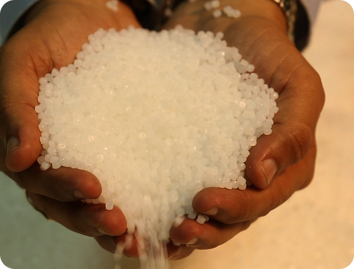 Petrochemical Pellets in Hands